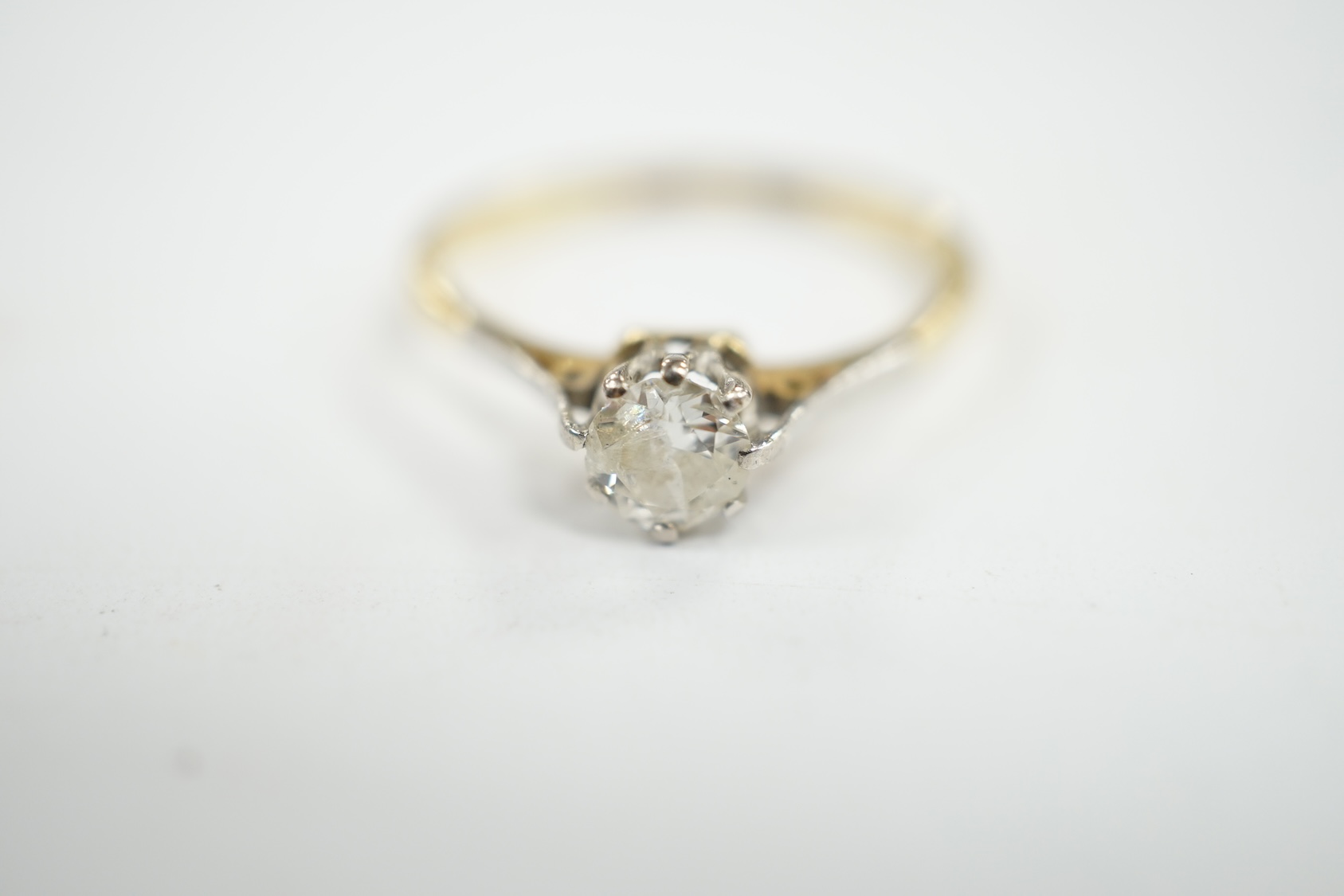 An 18ct and solitaire diamond ring, size O, gross weight 2.3 grams. Condition - fair